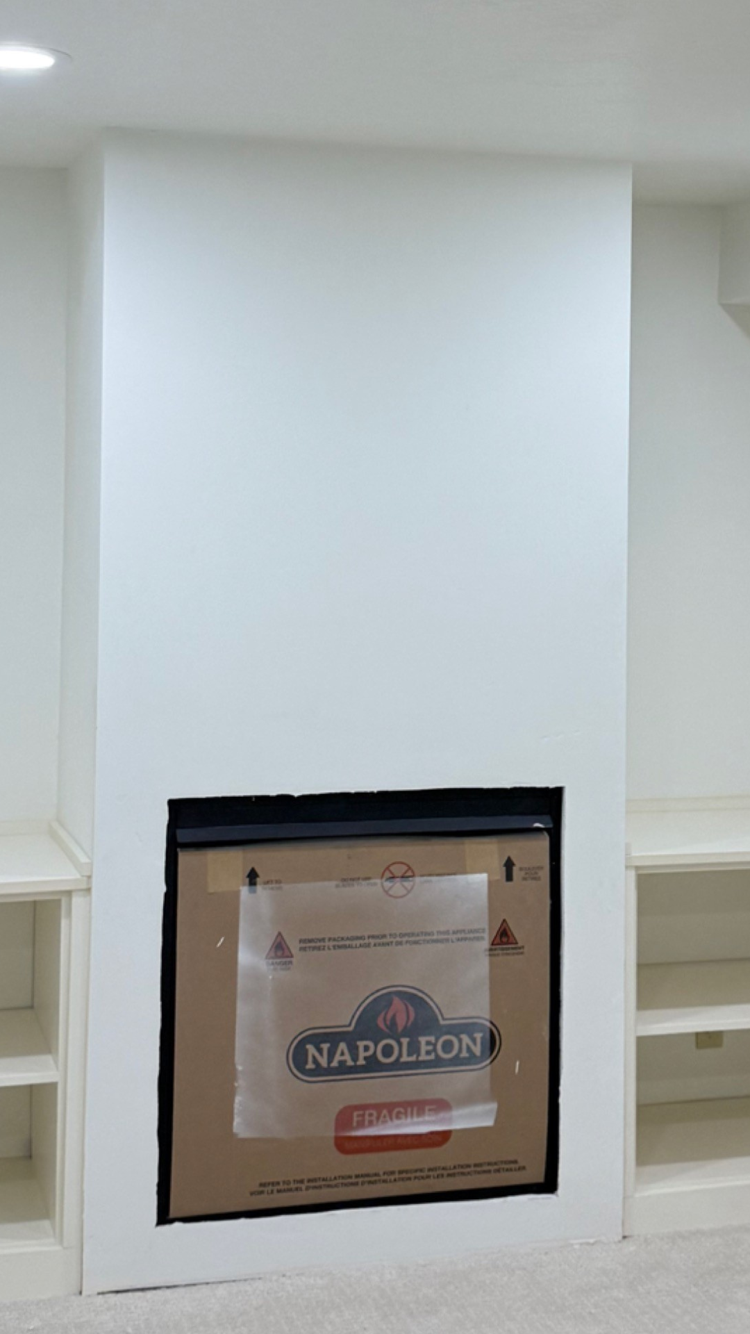 Drywall installation before and after - fireplace surround - before